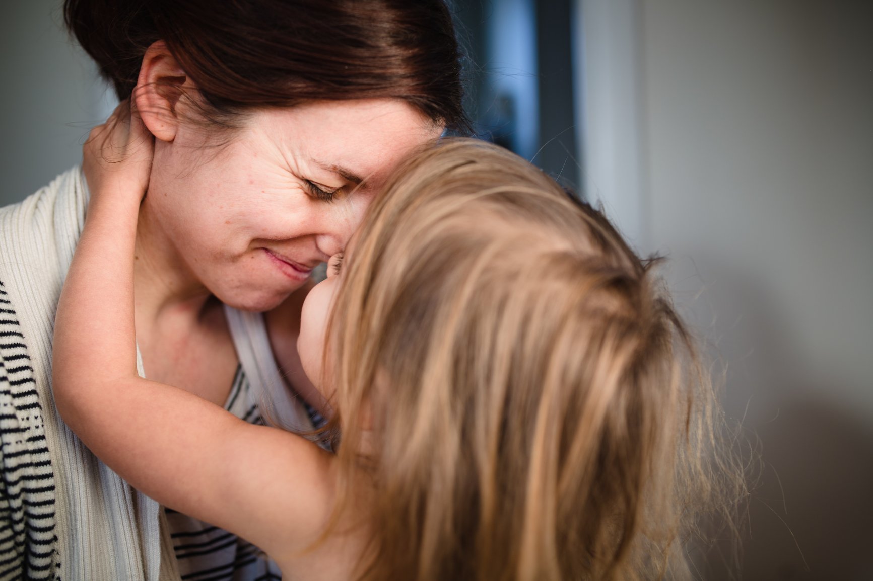 mother hugging child