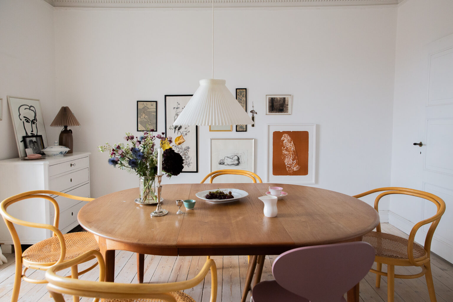 Photo inspiration: Danish Apartment Lighting Trends 2023 Reference: This Danish Apartment Filled With Books And Rugs Is An