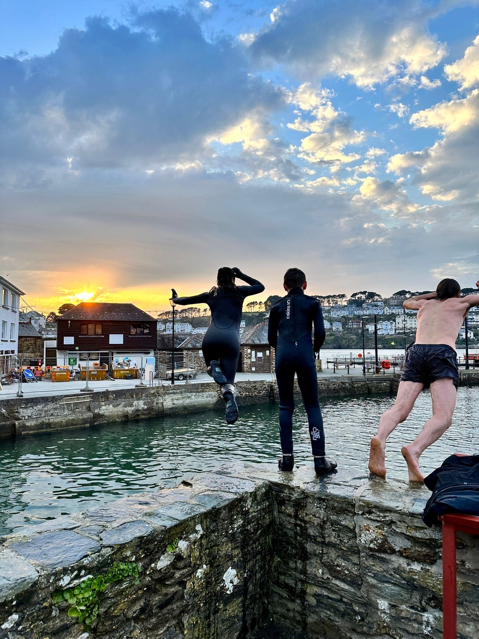 Cornwall jumping into sea harbor